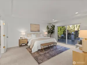 Main floor primary ensuite bedroom with 2 walk in closets, bathtub and separate shower. Sliding glass doors give you access to the 700+ sq ft deck.