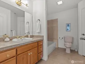 Full bathroom with large linen closet on second floor.