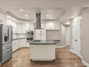 French doors to the right is a walk in pantry with tons of stoarge.