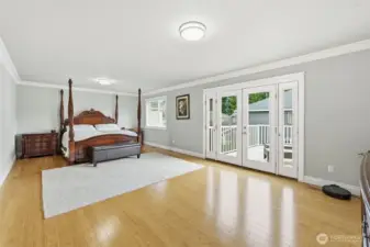 Large primary bedroom with private deck entrance.