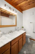 Main floor bath with tub and shower.