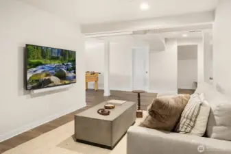 RH luxe down sofa and sonos surround sound level up movie and game night.