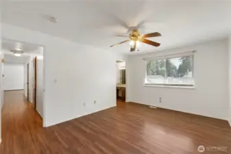 Owner's suite with walk in closet and attached bathroom.