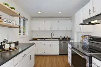 Spacious kitchen with stainless appliances.