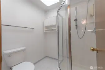 Primary bathroom stool and shower.