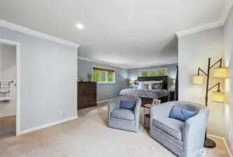 The primary suite has a large seating area, Juliette balcony, walk-in closet and a fully remodeled spa-like bath.