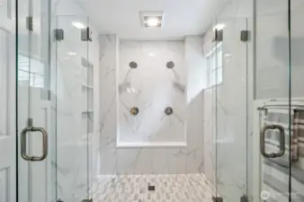 . . . and a huge shower with double glass doors and dual shower heads.