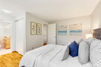 The primary features direct access to the full bathroom.