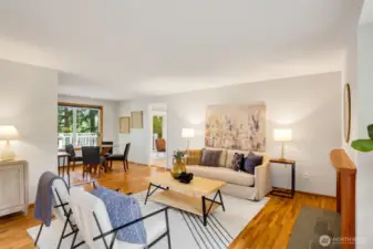 Quaint living room with original hardwoods.