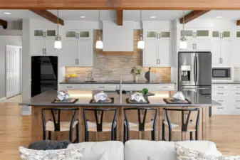 A gourmet kitchen, geared toward gatherings.