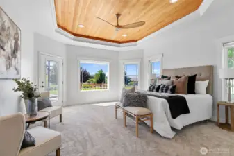 A true primary bedroom suite, with stunning views outside.