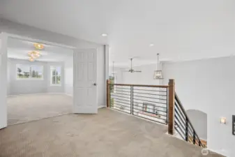 A central space at the top of the stairs leads to three bedrooms with smartly thought out bathroom spaces.