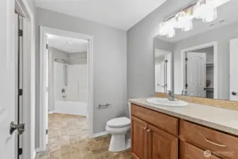 Between bedroom 4 and 5, two half baths are joined by a tub and shower for a combination of shared and separate bath facilities.