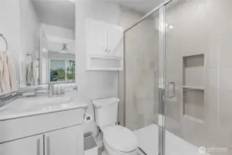 Primary bathroom with walk-in shower.