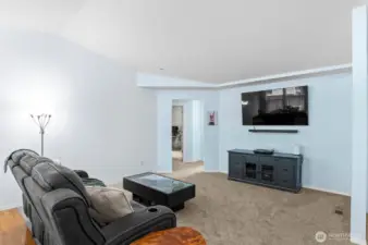 Relax or entertain in this spacious living area, completely refreshed with new interior paint and plush new carpeting.
