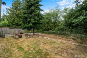 Escape to a private, peaceful backyard, ideal for summer BBQs and family gatherings.