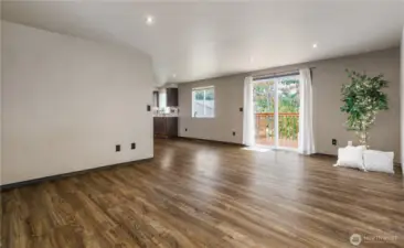 Living room open to Dining and Kitchen
