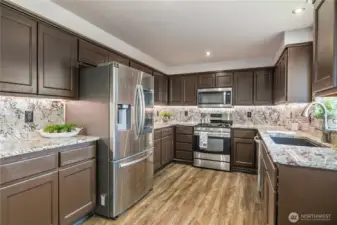 Stainless steel appliances remain with home.  Plethora of counterspace