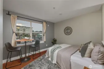 Dining Nook - Light-Filled and Laid Back  This charming dining space is perfectly positioned by a large window, offering treetop and neighborhood views. It’s the ideal spot for a sunny breakfast or evening glass of wine.
