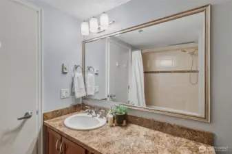 Enjoy a full bath with modern fixtures, plenty of counter space, and attractive built-in shelving. Clean, bright, and move-in ready.