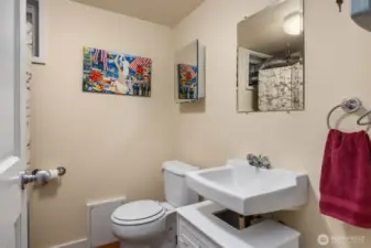 Half bath in lower level is common area, right down the hall from Unit A's bonus room