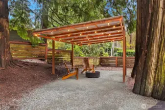 Covered carport area to the side of the driveway.