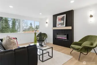 Open concept living room w/ fireplace
