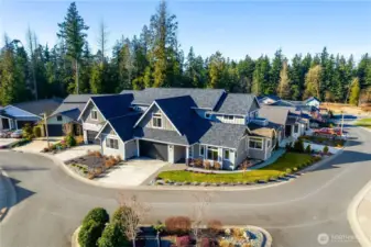 Premium 50 Year Roof! The stamped and stained flat driveway is located directly on a cul-de-sac/roundabout, which is very convenient for access and turnarounds.