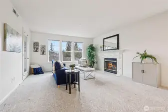 Gorgeous living room with warm fireplace (wood burning) and fresh paint to bring in your own color!
