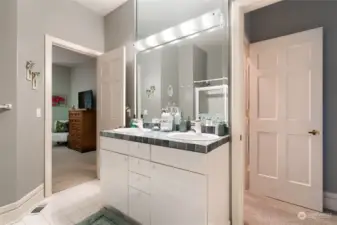 Full bath that is located between bedroom #2 and bedroom #3 with dual sinks.