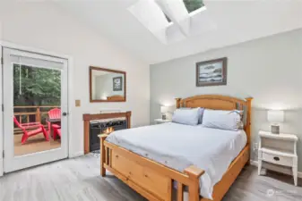 Primary Bedroom w/Door to Private Deck, 2nd Fireplace, Vaulted Ceilings and Skylights!