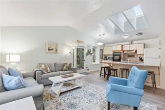 View looking toward the Kitchen. Notice the Vaulted Ceilings and Skylights!