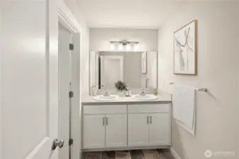 Upper floor bathroom offers double sink vanity convenience.                                                      virtually staged