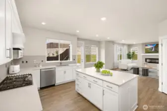Thoughtfully designed, the spacious kitchen is a chef's delight, featuring ample storage, cupboard, counter space. Handy pantry, 5 burner gas stove and versatile center island for you and yours.                        virtually staged