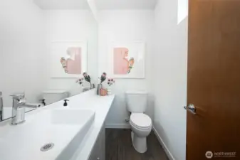 The thoughtfully designed guest bath enhances comfort and convenience, making it easy to host friends and family with style.