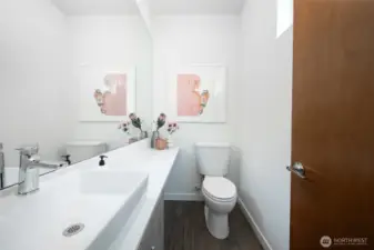 The thoughtfully designed guest bath enhances comfort and convenience, making it easy to host friends and family with style.