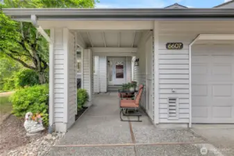 Covered Entryway with garage on your Right.