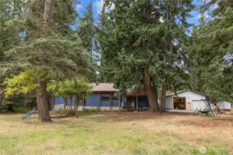 View of the home and shop from the back yard.