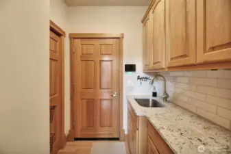 Butler pantry off of the kitchen  with an abundance of storage and the Entry into the oversized garage