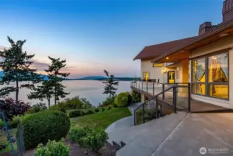 Expansive terraces perfectly positioned to take in breathtaking sunsets and wide-open water views through Thatcher Pass.  Sunsets are a light show and the sun sets and the afterglow lights the sky.
