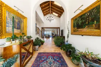 Step inside to vast foyer with soaring ceilings and architectural creating anticipation of the timeless elegance that awaits. The floor is rare large tiles of tumbled limestone.