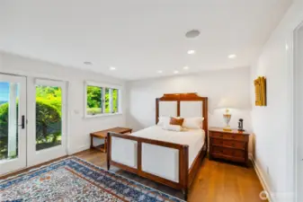 A spacious guest suite includes a fireplace, walk-in closet, and French doors that open to the grounds.