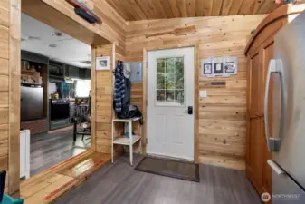 Full size fridge and pantry to the right.