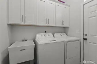 Main level Laundry room, w/ access to back patio