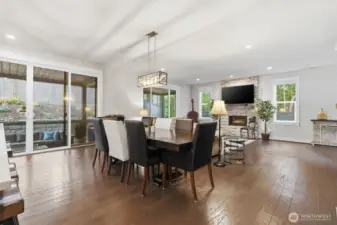 Dining area flows seamlessly to outdoor covered patio area beyond double slider.