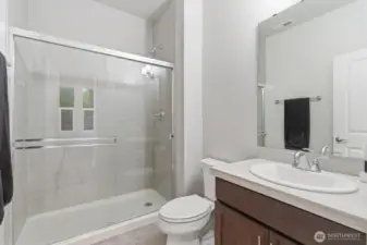Main level 3/4 bathroom conveniently located near the Great Room and main floor bedroom/office.