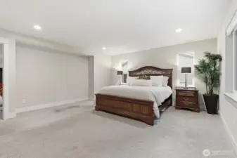 Primary bedroom with alcove offers a sitting area space to enjoy your morning cup of coffee from your reading nook.