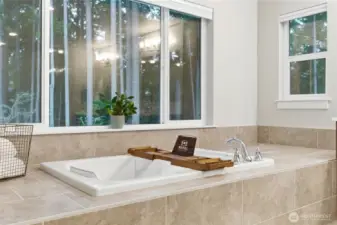 Enjoy an evening bubble bath amongst the trees in your recessed oversized bathtub.