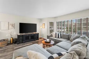 cozy oversized living room with tons of natural light. 13911 113th Ave Ct E, Puyallup, WA 98374