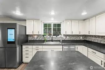 Updated kitchen with stainless appliances. 13911 113th Ave Ct E, Puyallup, WA 98374